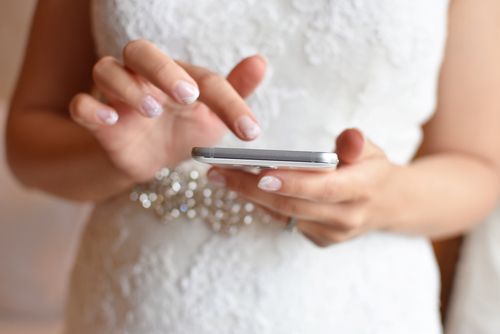 Bride Looking at Her Phone