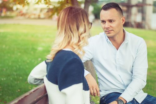 Couple on a Park Bench Having a Conversation