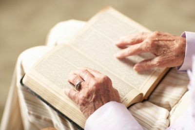 Elderly Person Reading the Bible