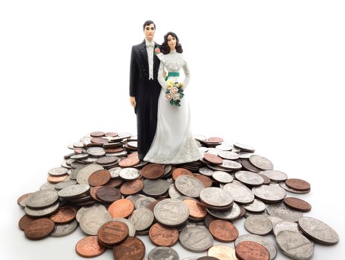 Groom and Bride Atop a Pile of Coins