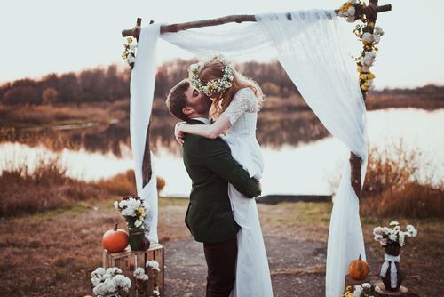 Groom and Bride in Front of a Lake