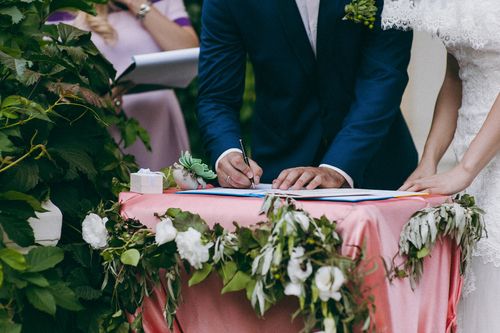 Groom Signing the Marriage License