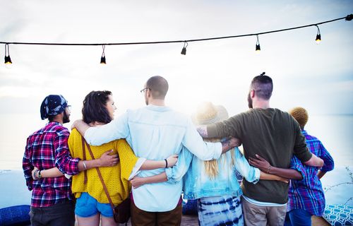 Group of Friends With Their Arms Around Each Other