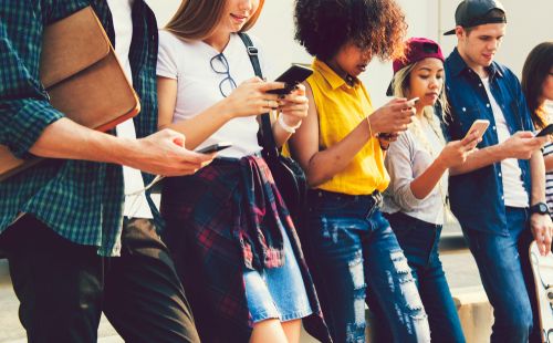 Group of Young Adults Looking at Their Phones