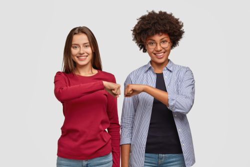 Two Women Bumping Fists