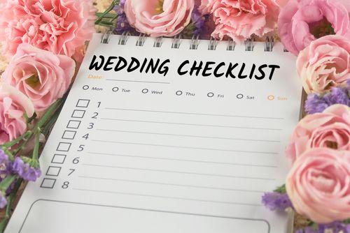 Wedding Checklist Surrounded by Pink Roses