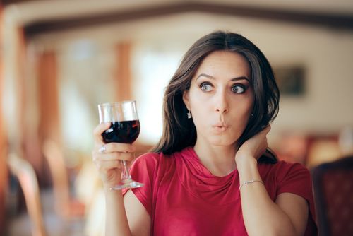 Wedding Guest Holding a Glass of Wine