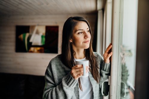 Woman Looking Out the Window