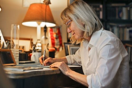 Woman writing at a desk