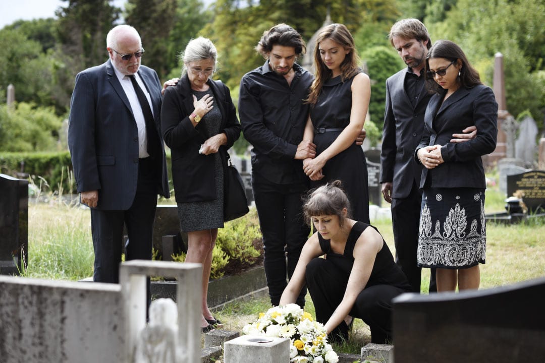 Family at funeral saying goodbye