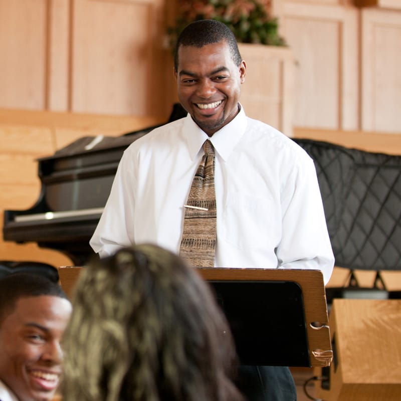 Smiling ordained minister in his ministry